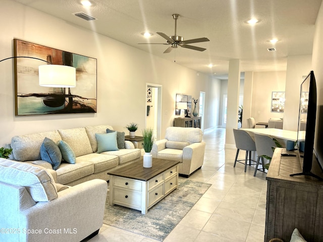 1225 Kylar Dr NE, Palm Bay, FL 32907 - living room featuring a ceiling fan, recessed lighting, and light tile patterned floors