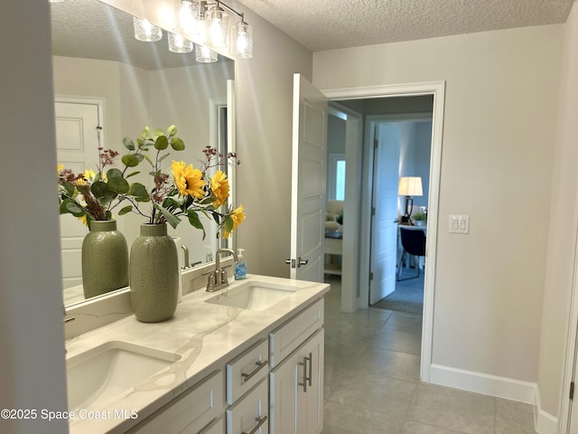 1225 Kylar Dr NE, Palm Bay, FL 32907 - full bathroom featuring a textured ceiling, double vanity, and tile patterned floors