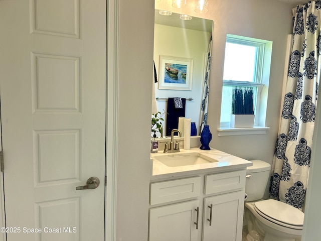 1225 Kylar Dr NE, Palm Bay, FL 32907 - bathroom featuring vanity and toilet