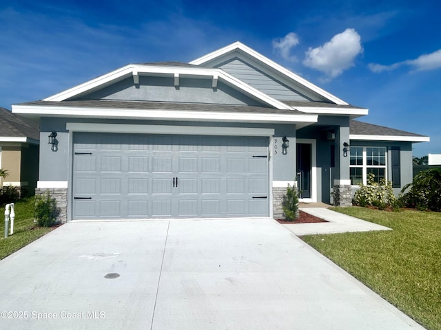1225 Kylar Dr NE, Palm Bay, FL 32907 - view of front of property featuring stone siding, concrete driveway, and an attached garage