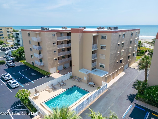 1525 S Atlantic Ave Unit 401, Cocoa Beach, FL 32931 - community pool with a water view and a patio