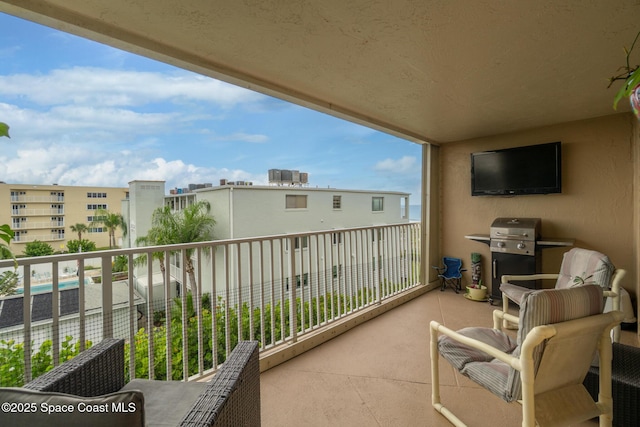 1525 S Atlantic Ave Unit 401, Cocoa Beach, FL 32931 - balcony featuring area for grilling