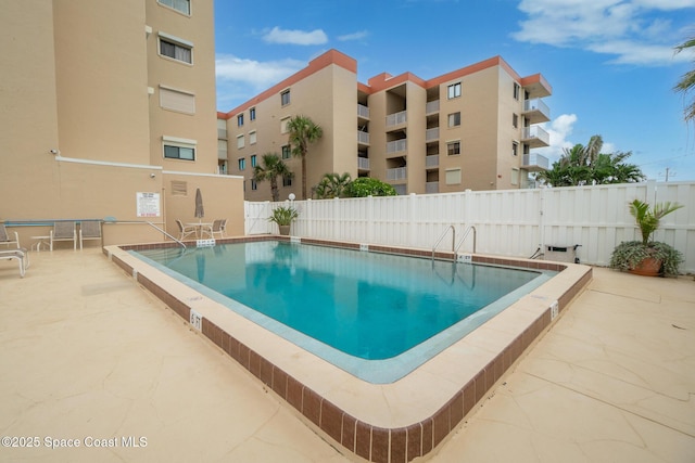 1525 S Atlantic Ave Unit 401, Cocoa Beach, FL 32931 - community pool featuring a patio area