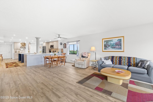 1525 S Atlantic Ave Unit 401, Cocoa Beach, FL 32931 - living room with light wood finished floors, recessed lighting, and ceiling fan