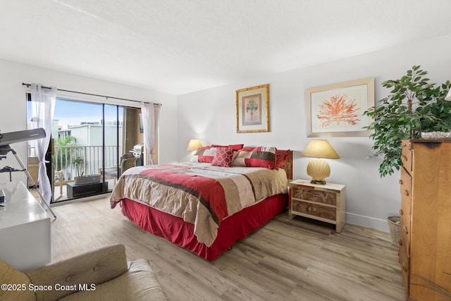 1525 S Atlantic Ave Unit 401, Cocoa Beach, FL 32931 - bedroom with access to outside and wood finished floors