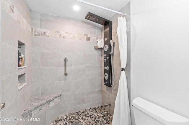 1525 S Atlantic Ave Unit 401, Cocoa Beach, FL 32931 - bathroom with a tile shower and toilet