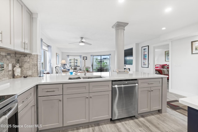 1525 S Atlantic Ave Unit 401, Cocoa Beach, FL 32931 - kitchen featuring dishwasher, gray cabinets, open floor plan, decorative backsplash, and light countertops