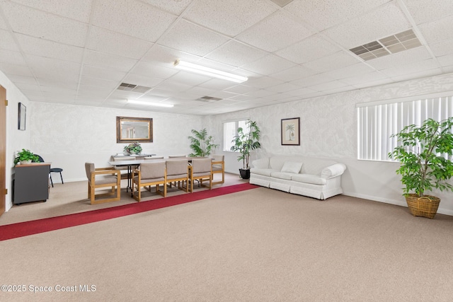 1525 S Atlantic Ave Unit 401, Cocoa Beach, FL 32931 - carpeted living area featuring a drop ceiling
