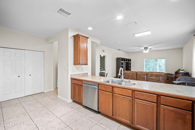 500 Loxley Ct, Titusville, FL 32780 - kitchen featuring stainless steel dishwasher, light countertops, brown cabinetry, a ceiling fan, and light tile patterned flooring