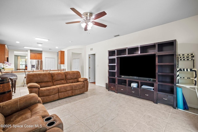 500 Loxley Ct, Titusville, FL 32780 - living room with a ceiling fan and light tile patterned floors