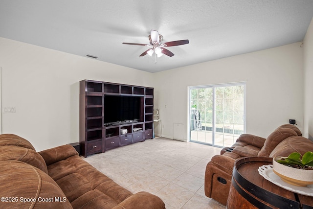500 Loxley Ct, Titusville, FL 32780 - living area with ceiling fan and light tile patterned floors