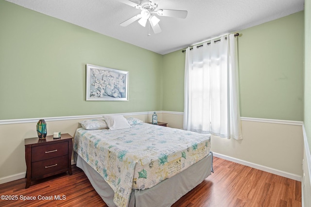 500 Loxley Ct, Titusville, FL 32780 - bedroom with wood finished floors and a ceiling fan