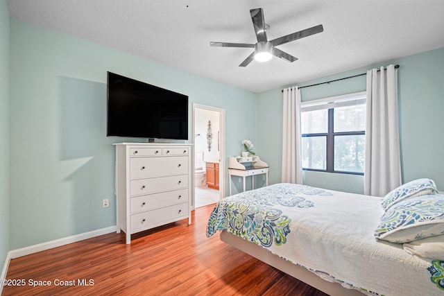 500 Loxley Ct, Titusville, FL 32780 - bedroom with wood finished floors, ceiling fan, and connected bathroom