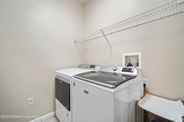 500 Loxley Ct, Titusville, FL 32780 - laundry area with washing machine and dryer and baseboards