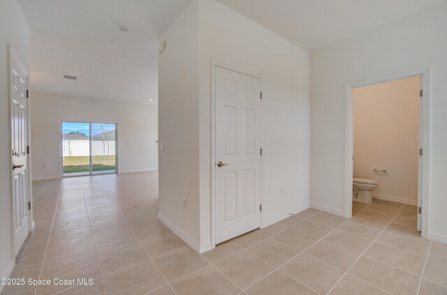 3265 Viridian Cir, West Melbourne, FL 32904 - hall with light tile patterned floors and baseboards