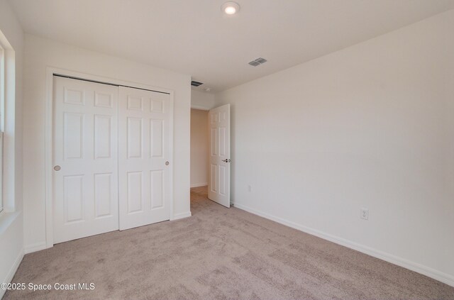 3265 Viridian Cir, West Melbourne, FL 32904 - unfurnished bedroom featuring carpet flooring, a closet, and recessed lighting