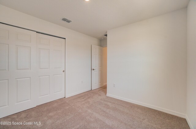 3265 Viridian Cir, West Melbourne, FL 32904 - unfurnished bedroom featuring light colored carpet and a closet