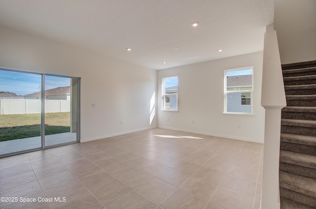 3265 Viridian Cir, West Melbourne, FL 32904 - spare room featuring stairs, light tile patterned flooring, and recessed lighting