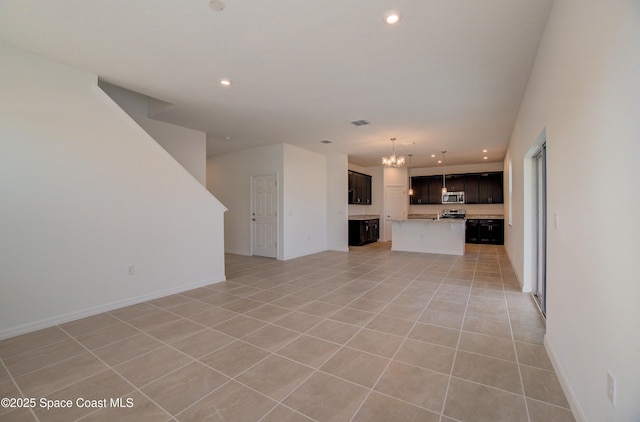 3265 Viridian Cir, West Melbourne, FL 32904 - unfurnished living room featuring a chandelier, light tile patterned flooring, and recessed lighting