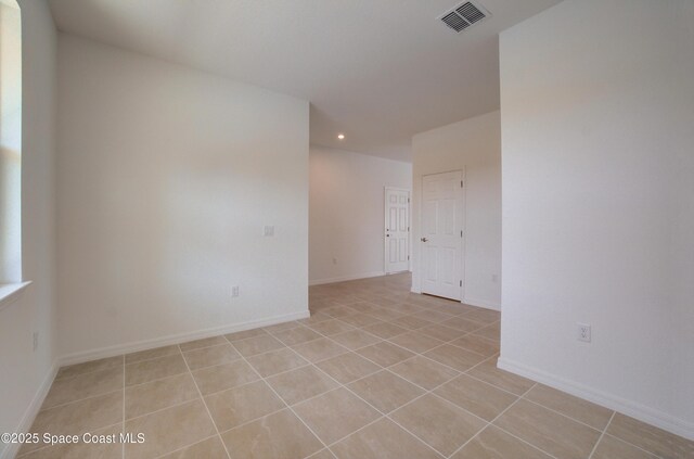 3265 Viridian Cir, West Melbourne, FL 32904 - empty room featuring light tile patterned flooring and recessed lighting