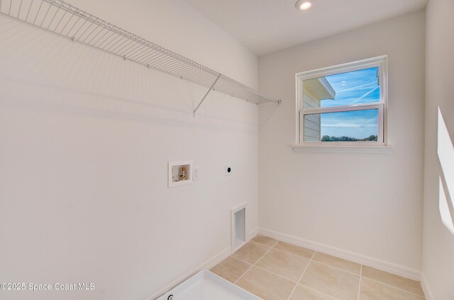 3265 Viridian Cir, West Melbourne, FL 32904 - laundry area featuring hookup for an electric dryer, hookup for a washing machine, recessed lighting, and light tile patterned flooring