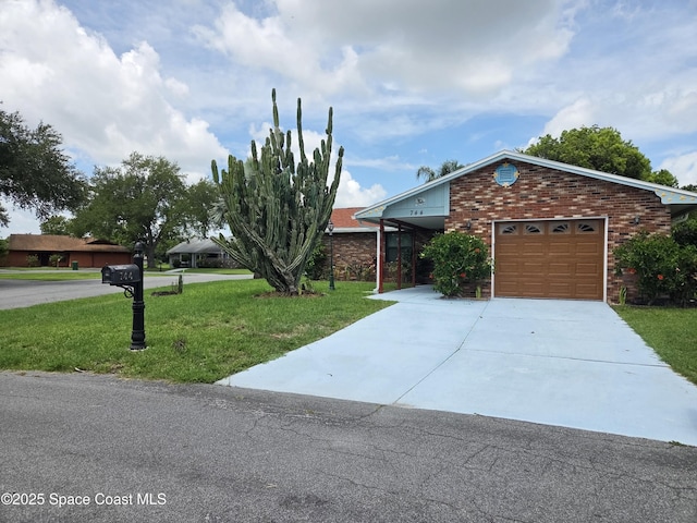 744 John Carroll Ln, Melbourne, FL 32904 - view of front of house with a front lawn, a garage, concrete driveway, and brick siding