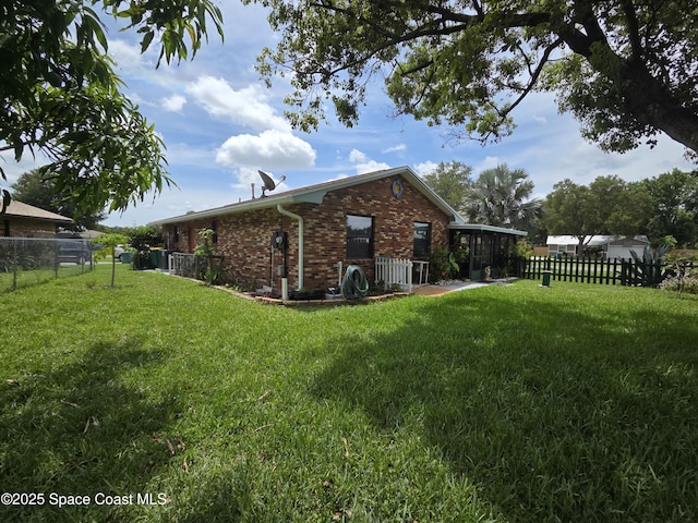 744 John Carroll Ln, Melbourne, FL 32904 - rear view of property featuring brick siding