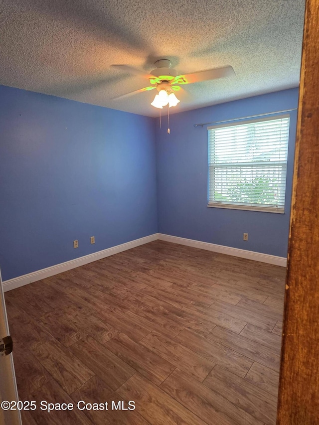 744 John Carroll Ln, Melbourne, FL 32904 - empty room with ceiling fan, a textured ceiling, and wood finished floors