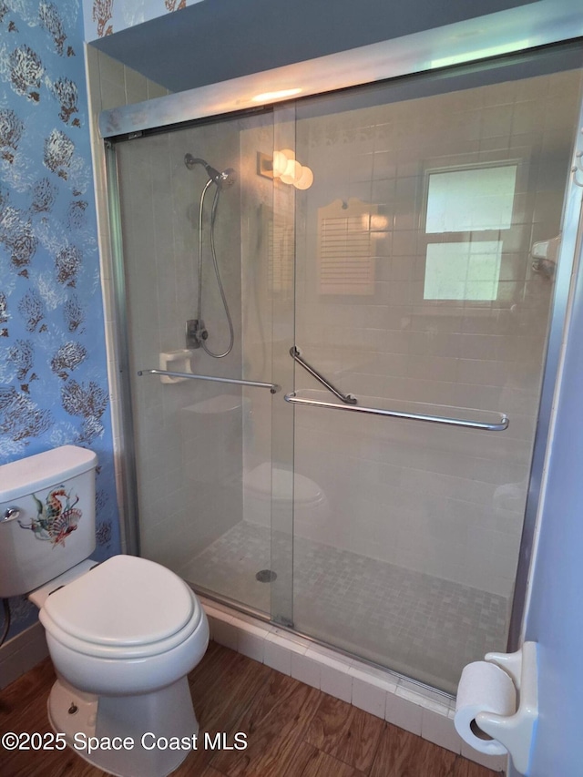 744 John Carroll Ln, Melbourne, FL 32904 - full bath featuring wallpapered walls, a shower stall, and wood finished floors