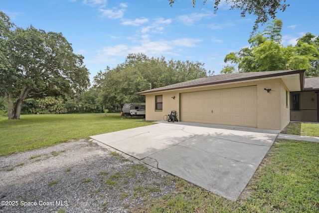 3375 Bryce St, Cocoa, FL 32926 - view of front of home with stucco siding, driveway, a front yard, and an attached garage