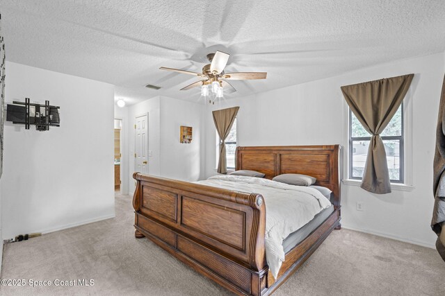 3375 Bryce St, Cocoa, FL 32926 - bedroom featuring light colored carpet, a textured ceiling, and a ceiling fan