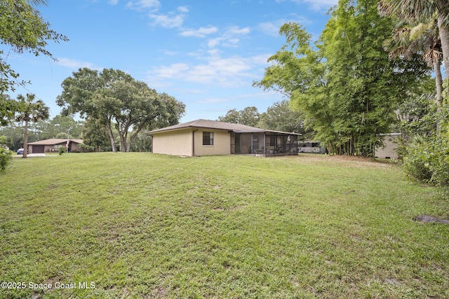 3375 Bryce St, Cocoa, FL 32926 - view of grassy yard with a sunroom