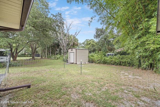 3375 Bryce St, Cocoa, FL 32926 - view of grassy yard featuring a shed