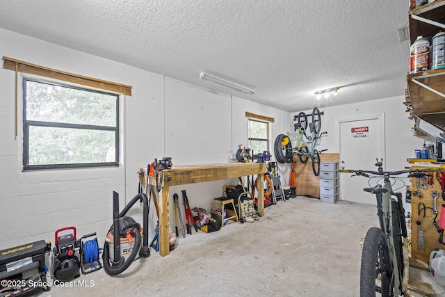 3375 Bryce St, Cocoa, FL 32926 - garage with a workshop area and concrete block wall