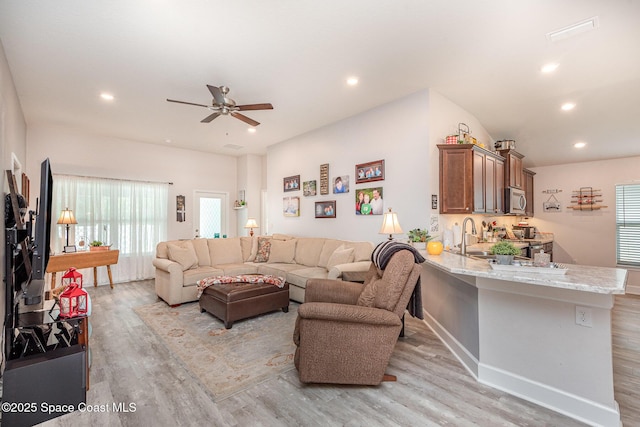 711 Tupelo Cir, Cocoa, FL 32926 - living room featuring light wood-type flooring, a ceiling fan, and recessed lighting