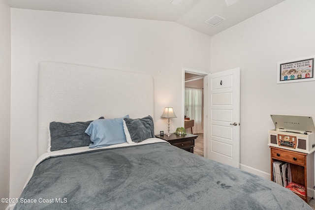 711 Tupelo Cir, Cocoa, FL 32926 - bedroom with lofted ceiling and baseboards