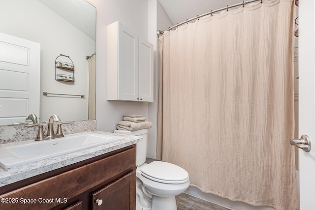 711 Tupelo Cir, Cocoa, FL 32926 - full bath with vanity, wood finished floors, and shower / bath combo with shower curtain