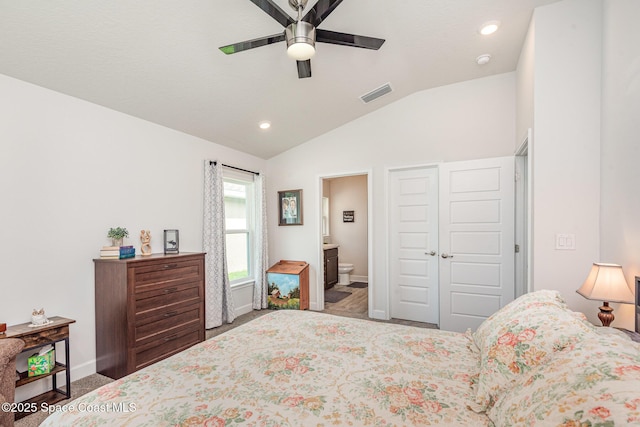 711 Tupelo Cir, Cocoa, FL 32926 - bedroom featuring vaulted ceiling, carpet, ensuite bathroom, recessed lighting, and ceiling fan
