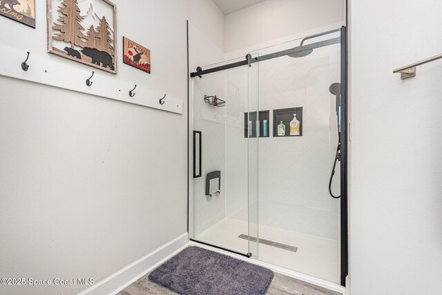 711 Tupelo Cir, Cocoa, FL 32926 - full bathroom featuring a shower stall and wood finished floors