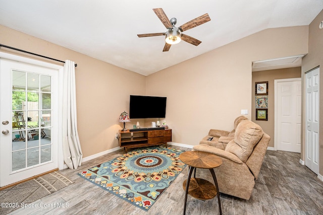 6355 Betty Ave, Cocoa, FL 32927 - living area with vaulted ceiling, wood finished floors, and a ceiling fan
