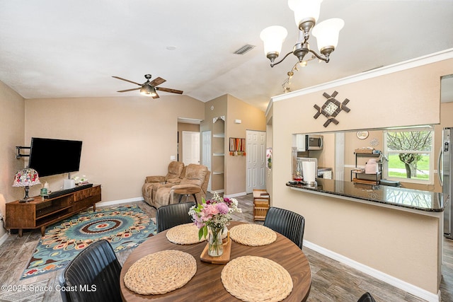 6355 Betty Ave, Cocoa, FL 32927 - dining room featuring lofted ceiling, ceiling fan, a chandelier, and wood finished floors
