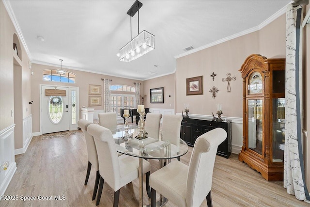 3616 Peninsula Cir, Melbourne, FL 32940 - dining area featuring light wood finished floors and crown molding
