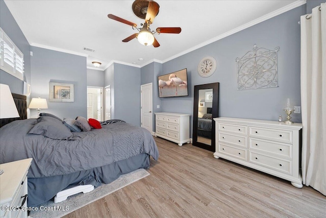 3616 Peninsula Cir, Melbourne, FL 32940 - bedroom with light wood-style flooring, crown molding, a ceiling fan, and ensuite bath