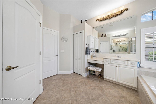 3616 Peninsula Cir, Melbourne, FL 32940 - bathroom with vanity, a relaxing tiled tub, and a shower