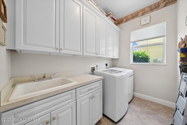 3616 Peninsula Cir, Melbourne, FL 32940 - laundry area with cabinet space and washer and clothes dryer