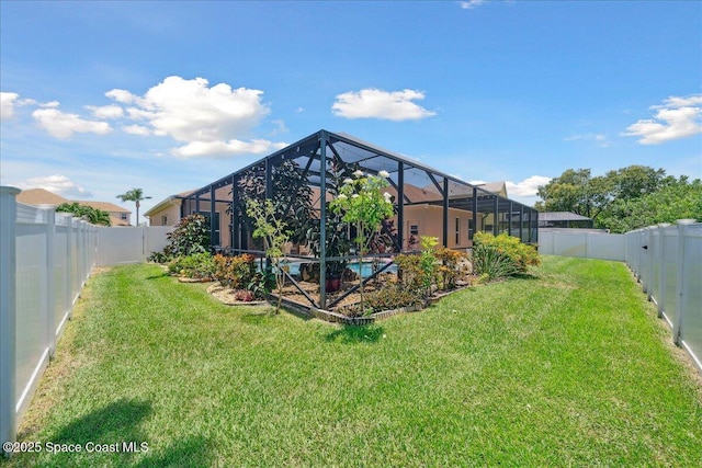 3616 Peninsula Cir, Melbourne, FL 32940 - back of house with a fenced backyard and a lanai