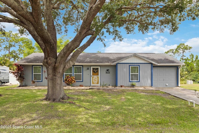 542 Troy Rd SW, Palm Bay, FL 32908 - single story home featuring a front yard, an attached garage, concrete driveway, and roof with shingles