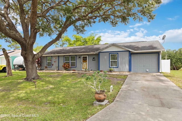 542 Troy Rd SW, Palm Bay, FL 32908 - ranch-style home featuring a garage, a front lawn, and concrete driveway