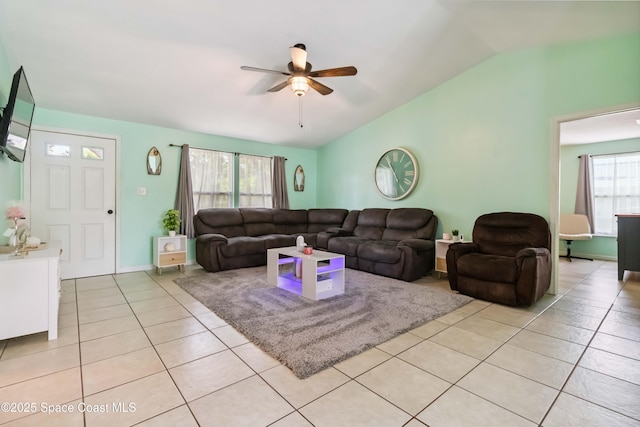 542 Troy Rd SW, Palm Bay, FL 32908 - living room featuring a ceiling fan, light tile patterned floors, and lofted ceiling