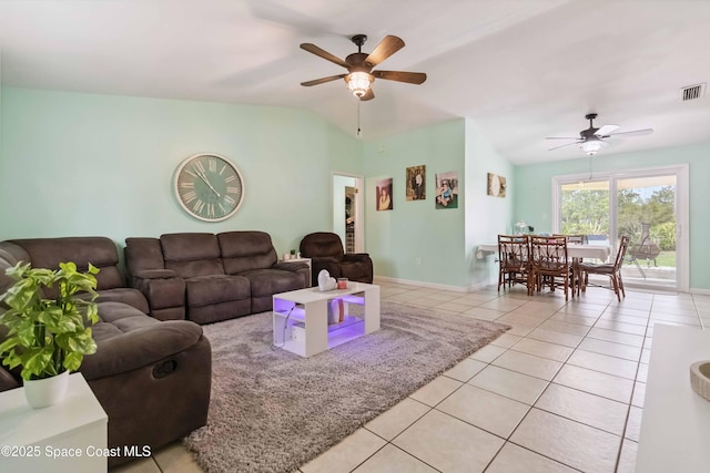 542 Troy Rd SW, Palm Bay, FL 32908 - living area featuring a ceiling fan, light tile patterned floors, and vaulted ceiling